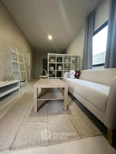 Modern living room with neutral tones and stylish furniture