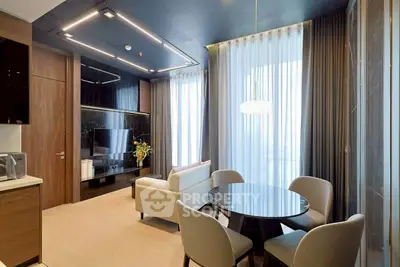 Modern living room with sleek furniture and large windows