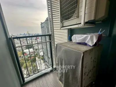 High-rise balcony with city view and air conditioning unit, perfect for urban living.