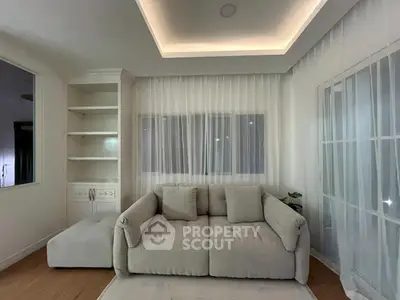 Cozy living room with plush sofa and elegant lighting