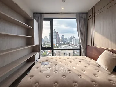 Modern bedroom with city view and built-in shelves in high-rise apartment