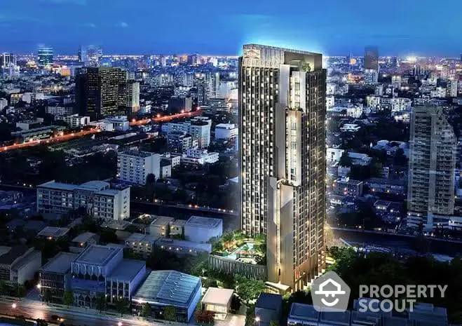 Stunning high-rise building with cityscape view at night, perfect for urban living.