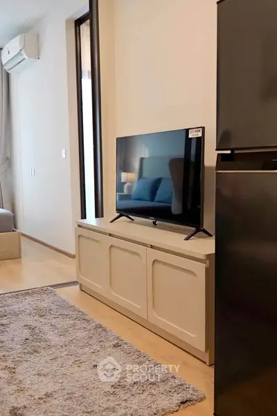 Modern living room with sleek TV setup and stylish decor
