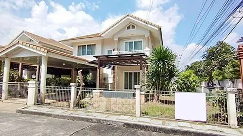 Charming two-story house with spacious front yard and modern design