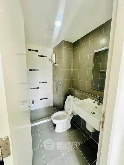 Modern bathroom with sleek tiles and contemporary fixtures