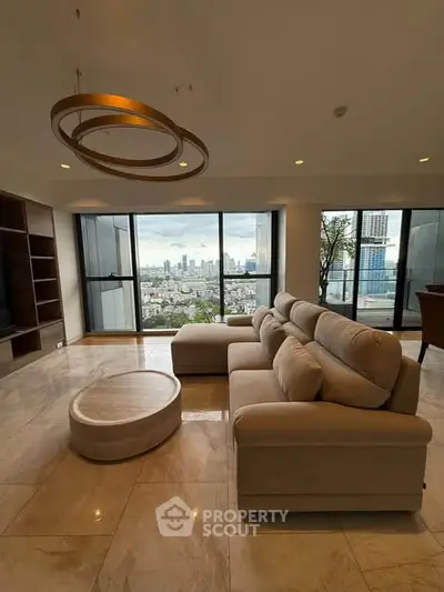 Luxurious living room with stunning city view, modern furniture, and elegant lighting in high-rise apartment.