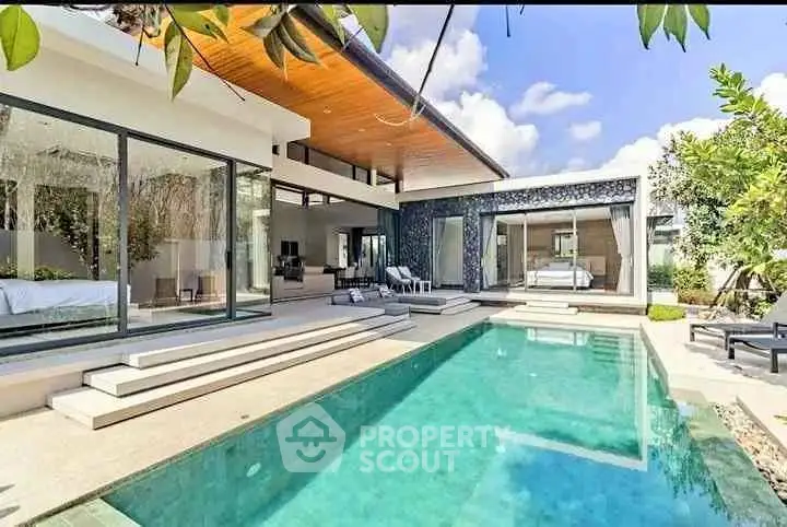 Luxurious modern villa with private pool and spacious outdoor area, perfect for relaxation and entertainment.