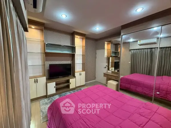 Cozy bedroom with modern decor and mirrored wardrobe