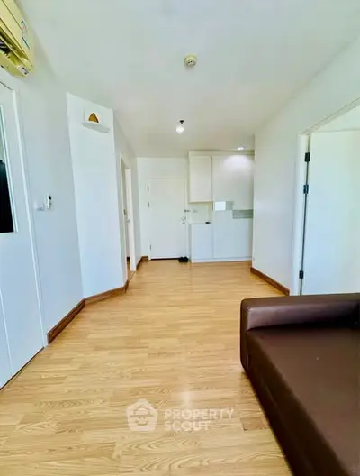 Spacious modern apartment interior with wooden flooring and minimalist design