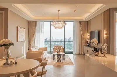 Luxurious living room with elegant chandelier and stunning city view, featuring modern decor and spacious layout.