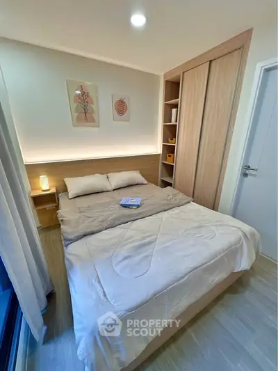 Cozy modern bedroom with stylish decor and ample storage space