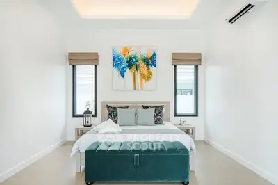 Modern bedroom with stylish decor and natural light