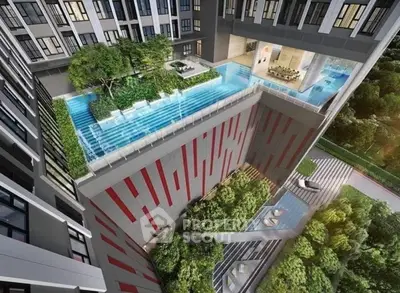 Stunning modern building with unique elevated pool and lush greenery