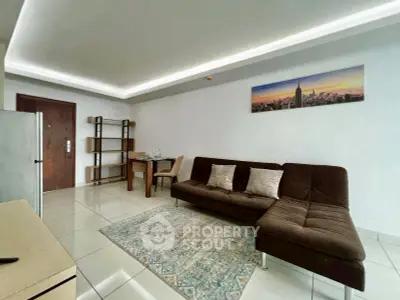 Modern living room with sleek furniture and stylish decor in a contemporary apartment.