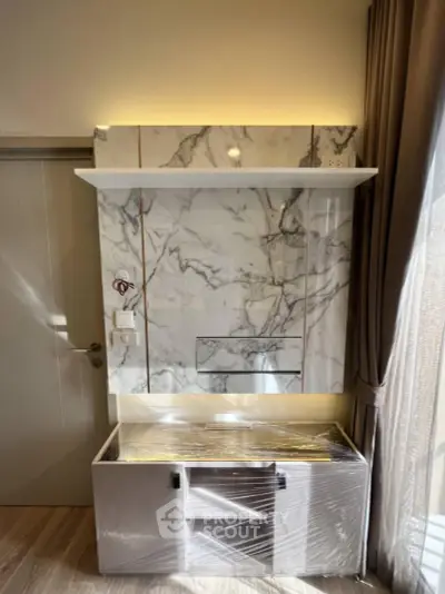 Modern interior with marble accent wall and stylish storage unit