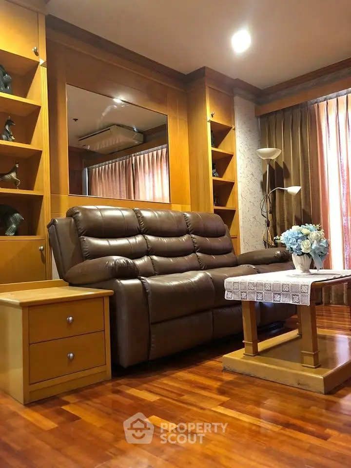 Luxurious living room with leather sofa and elegant wooden decor