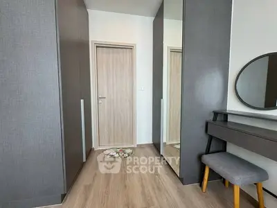 Modern bedroom with stylish wardrobe and vanity area
