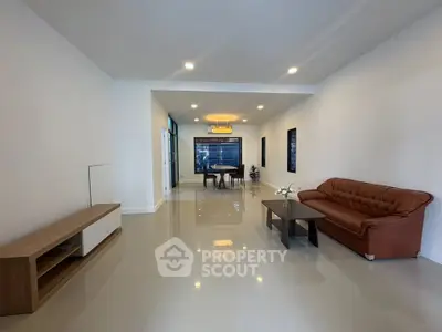 Spacious modern living room with elegant furniture and bright lighting