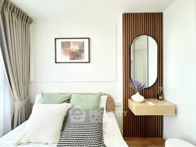 Modern bedroom with stylish decor and natural light