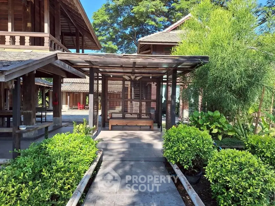 Charming wooden exterior with lush greenery and traditional architecture, perfect for serene living.
