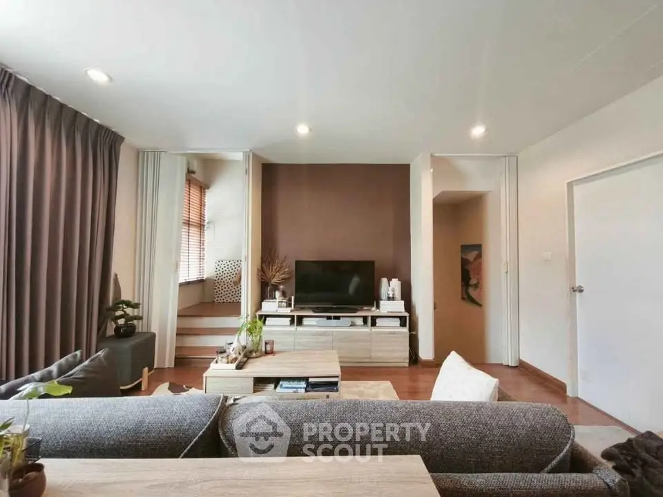 Modern living room with stylish decor and cozy seating area.