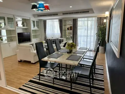 Spacious living and dining area with modern decor and natural light