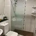 Modern bathroom with glass shower and sleek fixtures