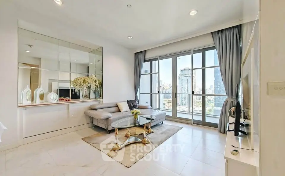 Luxurious living room with city view, elegant decor, and modern furniture in high-rise apartment.