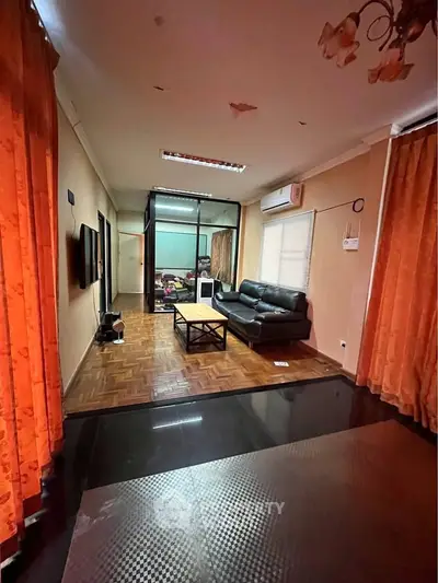 Spacious living room with cozy seating and modern decor