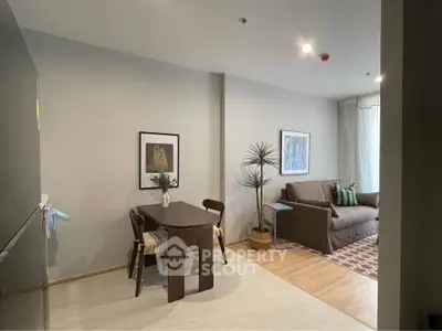 Modern living room with stylish decor and cozy seating area, perfect for relaxation and entertaining.