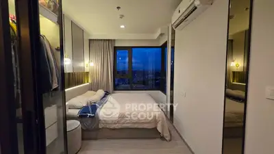 Cozy bedroom with city view and modern decor