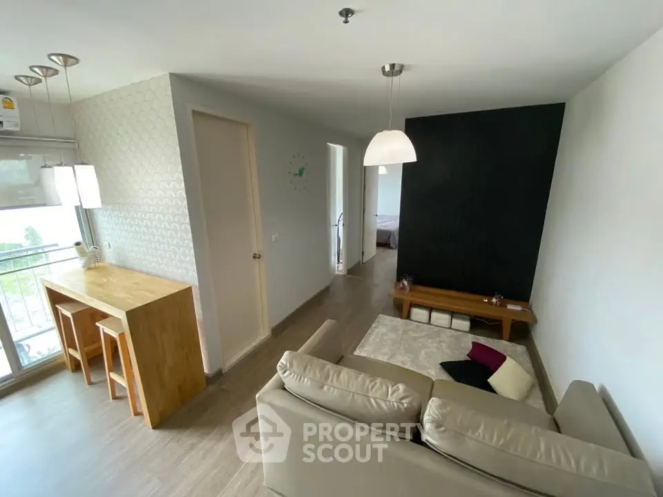 Modern living room with open layout and stylish decor in a contemporary apartment.