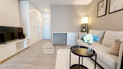 Modern living room with stylish decor, cozy sofa, and elegant furniture in a bright, inviting space.