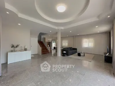 Spacious modern living room with elegant design and ample natural light