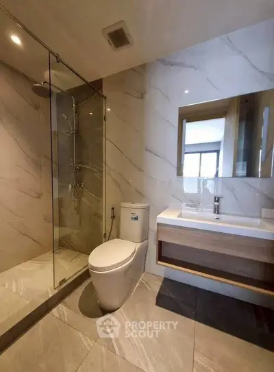 Modern bathroom with sleek design and glass shower enclosure