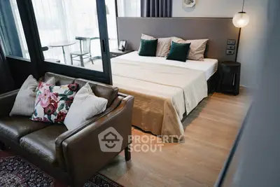 Luxurious bedroom with elegant decor and cozy seating area