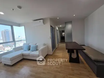 Spacious modern living room with city view and stylish furniture