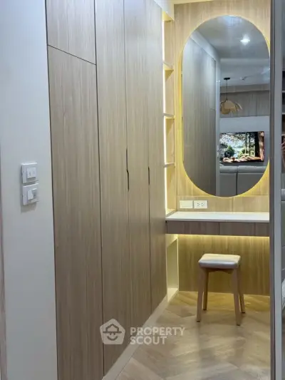 Modern bedroom with built-in wardrobe and stylish vanity area