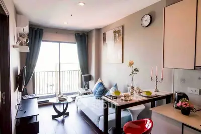 Modern living room with balcony access and stylish decor