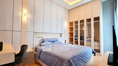 Luxurious modern bedroom with built-in wardrobe and elegant lighting