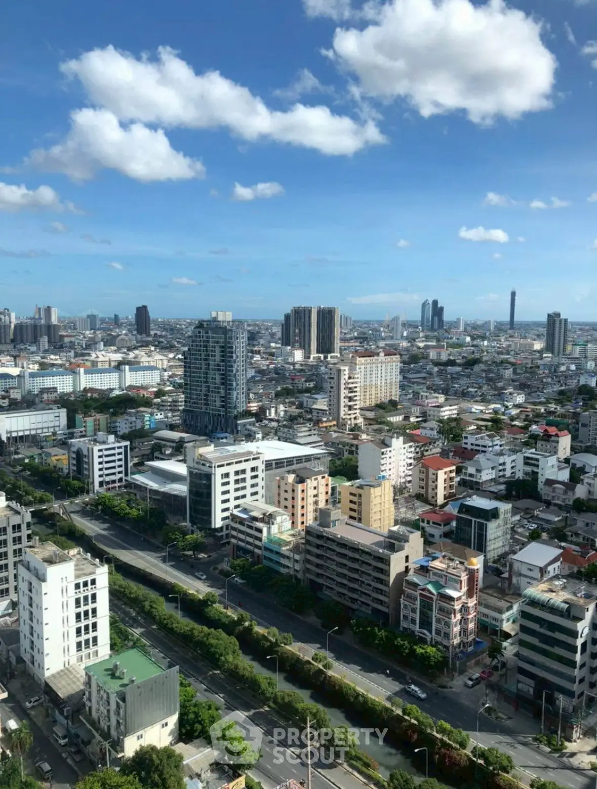 Stunning cityscape view from high-rise building showcasing urban skyline and vibrant city life.