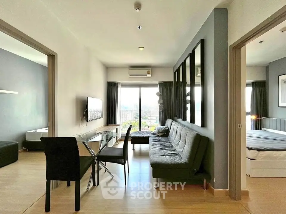 Modern apartment living room with stylish furniture and city view