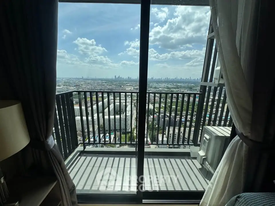 Stunning high-rise balcony view with expansive cityscape and skyline.