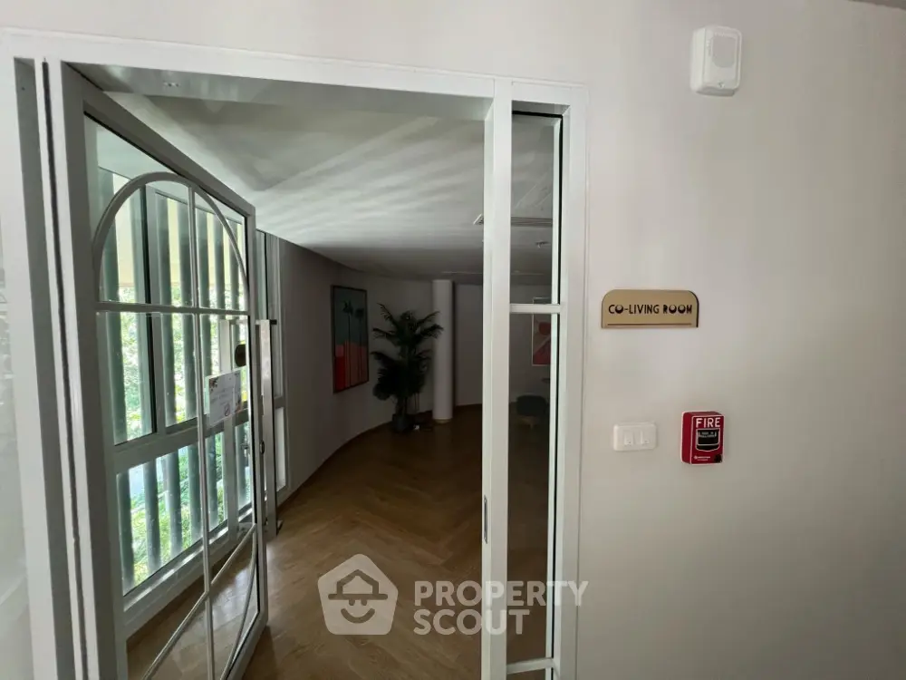 Modern co-living room entrance with stylish decor and natural light