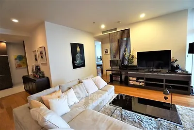 Spacious modern living room with elegant decor and cozy seating area.