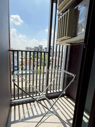 Charming balcony with city view, perfect for relaxation and enjoying the skyline.