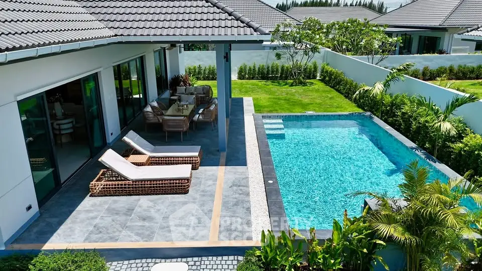 Luxurious villa with private pool and lush garden, perfect for relaxation and entertainment.