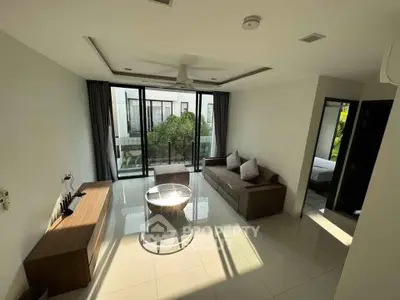 Modern living room with large windows and stylish furniture