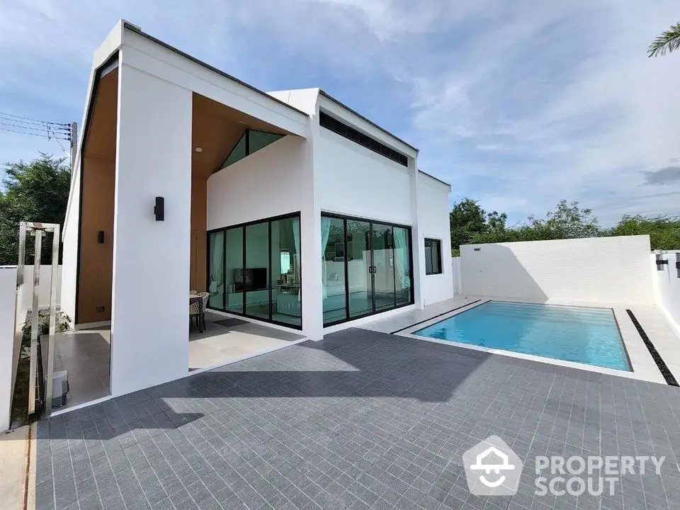 Modern luxury villa with private pool and sleek architectural design.