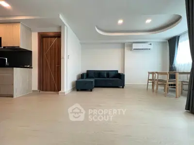 Spacious modern living room with sleek design and natural light